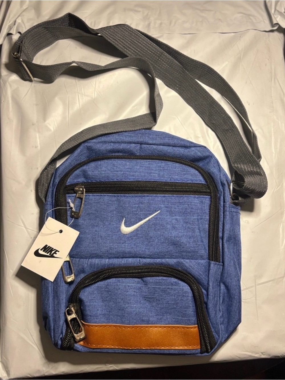 Nike Blue Crossbody Bag with Brown Accent and Gray Strap